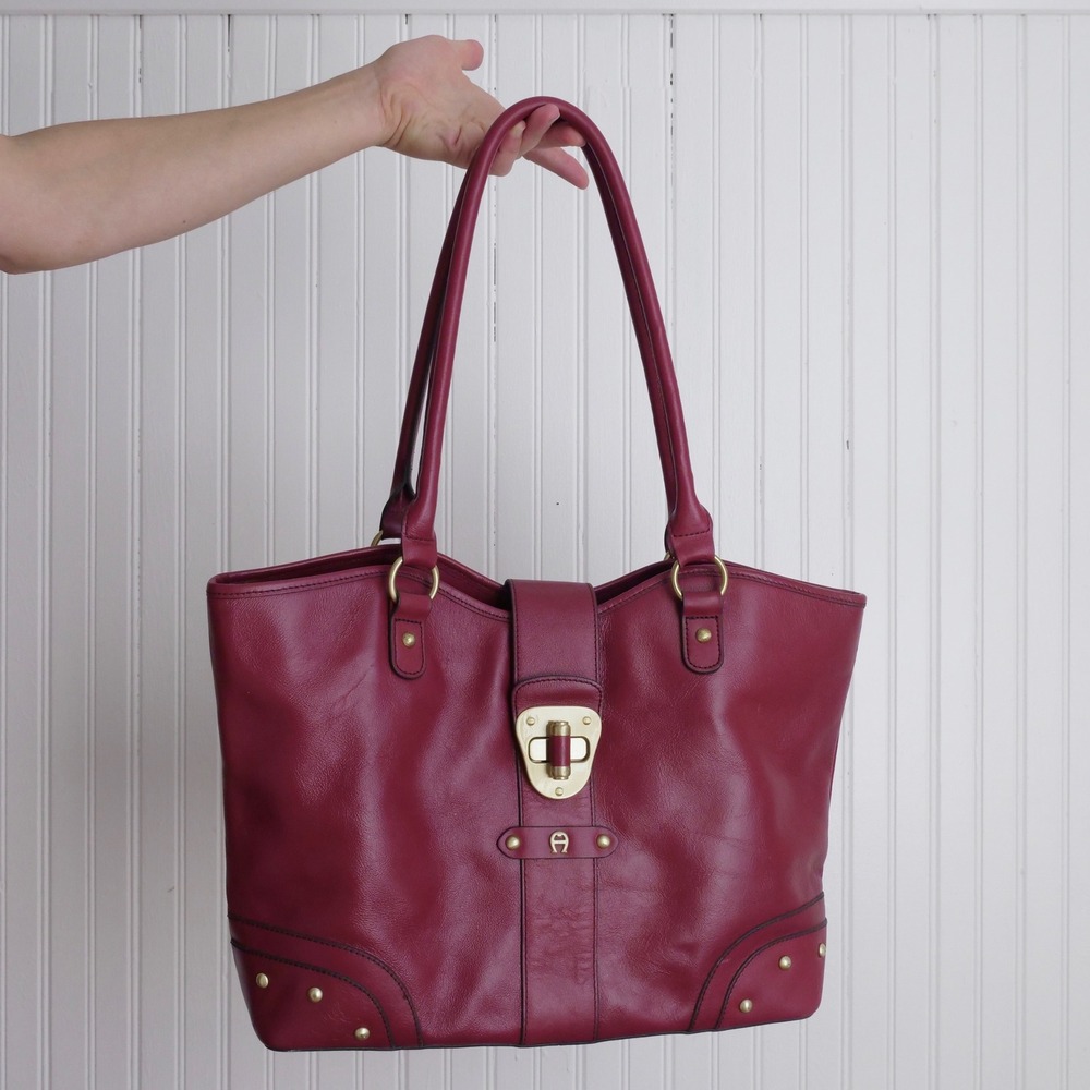 Chic Etienne Aigner burgundy leather shoulder tote with polished brass hardware
